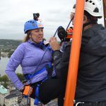 Photo of Monica Gould hesitant to rappell