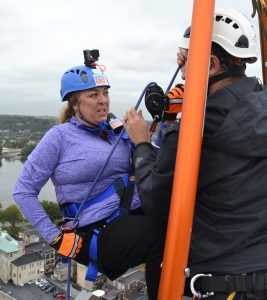 Photo of Monica Gould hesitant to rappell for fundraiser