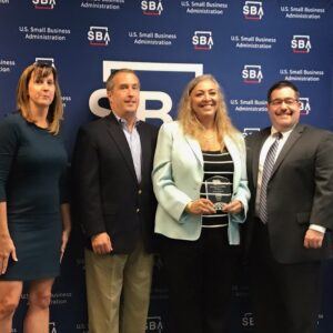 Monica Gould holding SBA Leaders Class award