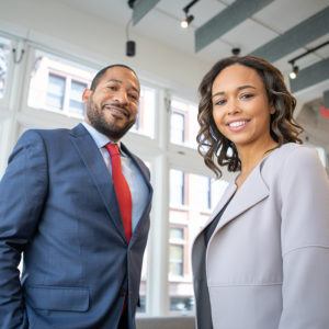 two black professionals posing