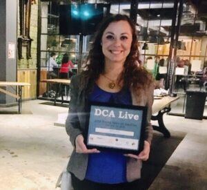 Jasmine Gould holding DCA Live award