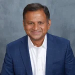 coach vinod jain smiling